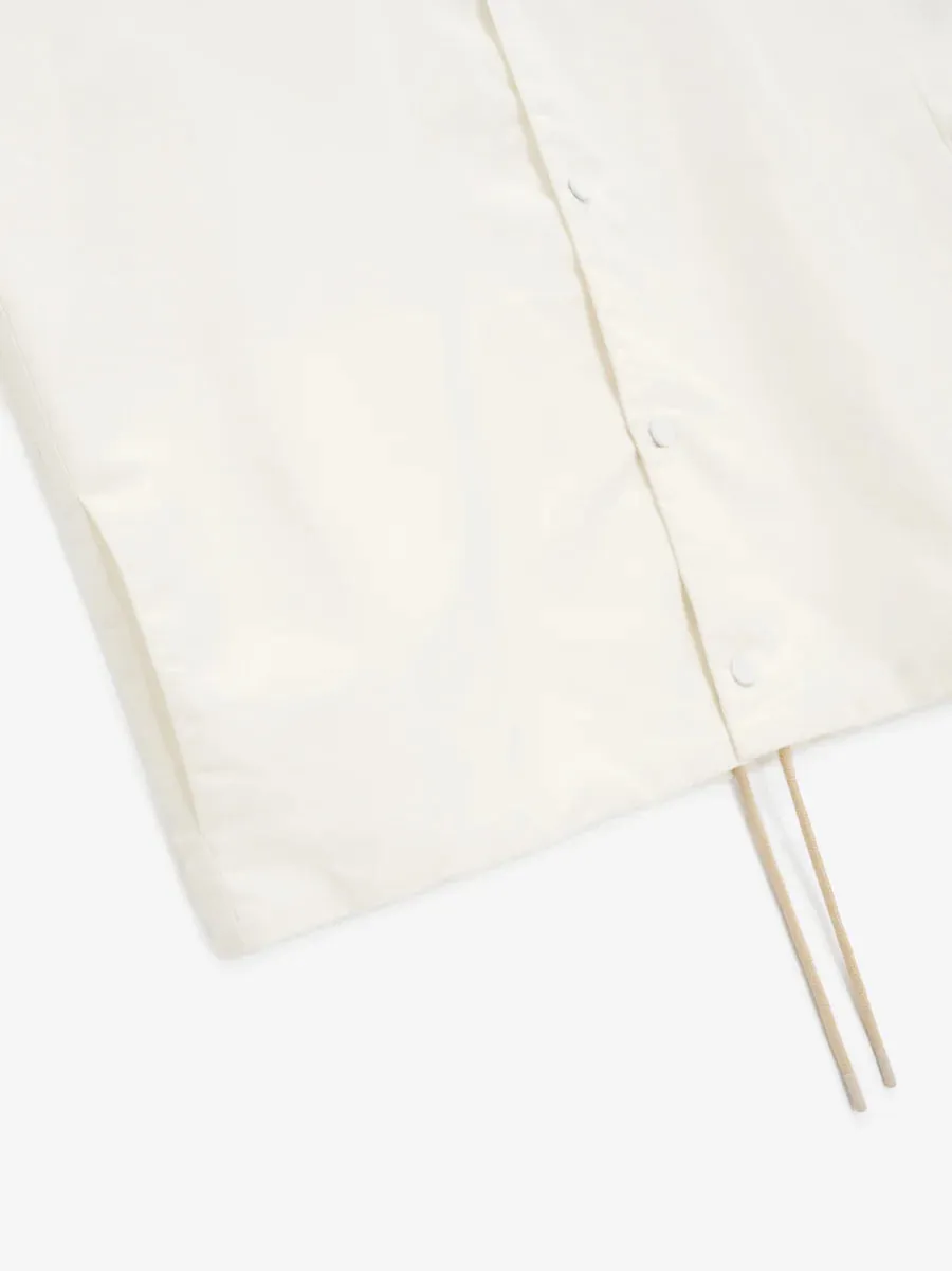 Fear of God Essentials Coaches Jacket in Cloud Dancer