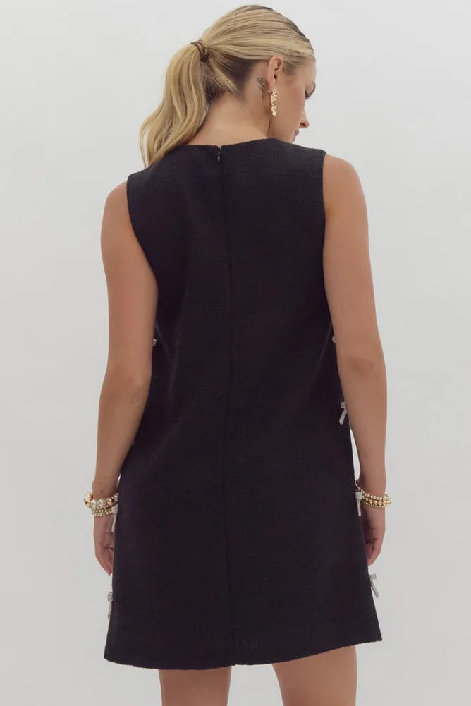 Textured Sleeveless Mini Dress with Bow Embellishments in Black by Entro